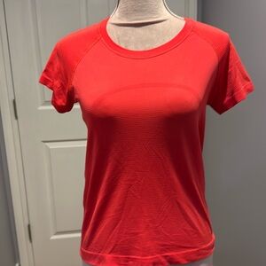 Lululemon swiftly race length great neon mango coloured tee